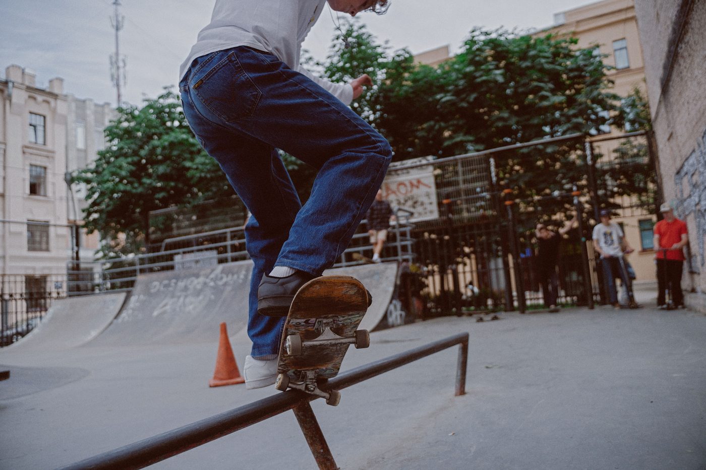 Skater grinding a metal rail