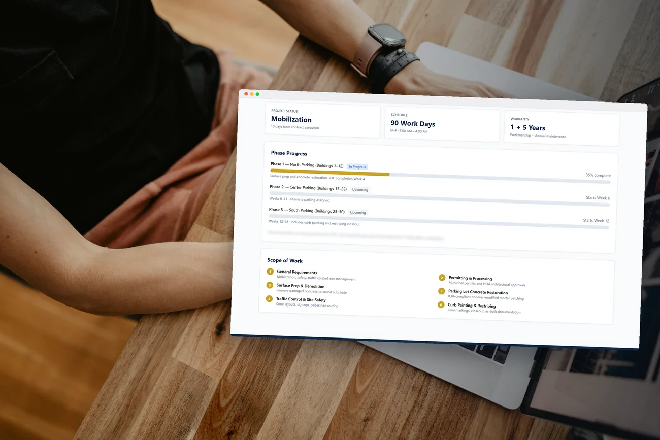 An owner portal we built, open on a laptop at a table, showing project status, phase progress and scope of work
